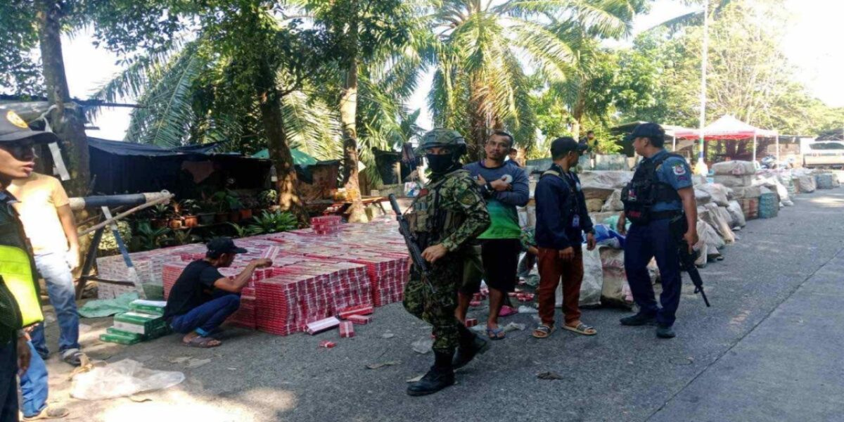 Law enforcers account the smuggled cigarettes seized during checkpoint operation in Pinantao Parang Maguindanao del Norte on Friday morning March 20 2026. Photo from PRO BARMM 1200x900 1